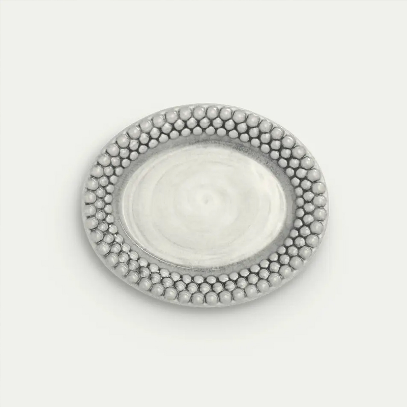 Oval bubbles tallrik i grå på 20x16 cm från Mateus.